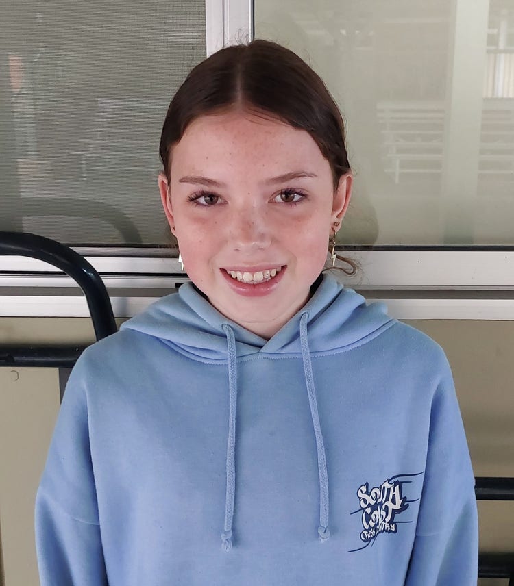 Portrait of smiling female student.